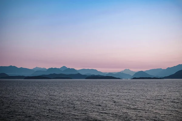 Early morning in the ocean and mountains near Vancouver Island. Beautiful sunrise. Dawn over the sea and mountains. Nobody, travel photo, copy space for text