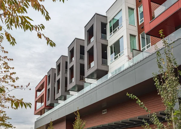 stock image Front view of modern designed concrete residential house. Apartment building with colorful facades. Modern minimalistic architecture