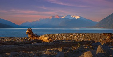 Beautiful sunset with snow mountain at Harrison lake Canada. Landscape for background. Travel photo, nobody, copy space for text, selective focus