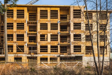 New low-rise apartments building construction. Housing construction in Canada. Street photo, nobody, selective focus
