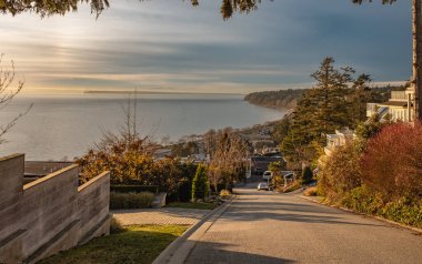 Vancouver White Rock residential area with Semiahmoo Bay. Beautiful sunset at typical Canadian residential area. Travel photo, nobody, selective focus, copyspace for text