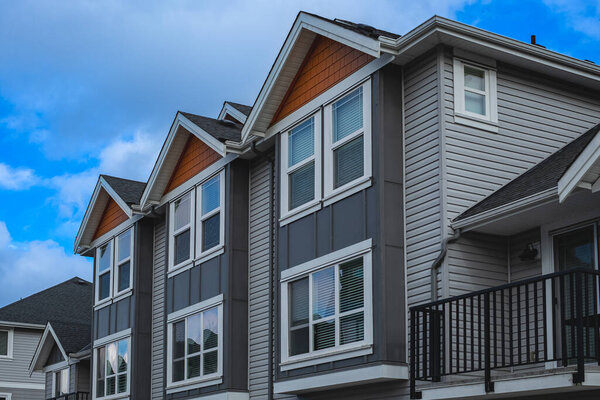 New Modern Apartment Buildings in Vancouver BC. Canadian modern residential architecture on sunny day. Nobody, street photo-Vancouver BC Canada