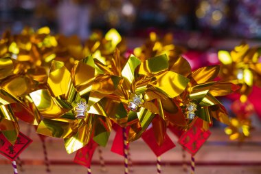 Chinese culture, windmills bring business lucky,in windmill fair in lunar new year at Temple. pinwheel Chinese gift used during new year festival. Nobody, blurred, selective focus