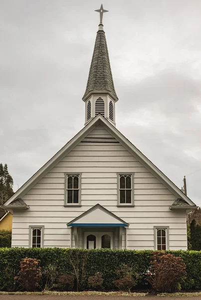 stock image Old wooden Church in overcast day. Old church with a spire in rural. Vancouver, Canada. Nobody, street photo