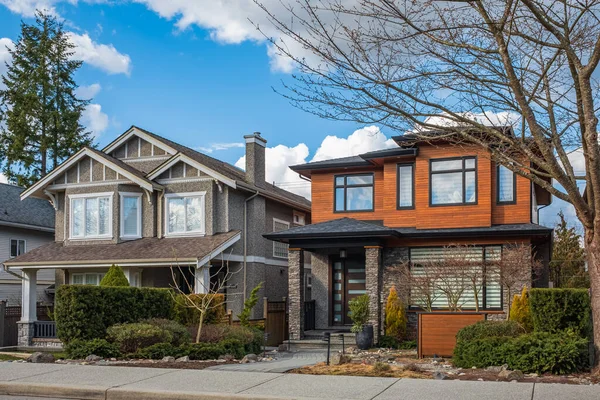 Stock image Real Estate Exterior Front House. Big custom made luxury houses with nicely landscaped front yard and fence in the suburbs of Vancouver Canada