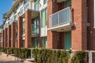 New residential townhouses. Modern apartment buildings in Canada. Modern complex of apartment buildings. Concept of real estate development, house for sale and housing market