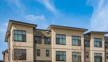New residential townhouses. Modern apartment buildings in Canada. Modern complex of apartment buildings. Concept of real estate development, house for sale and housing market