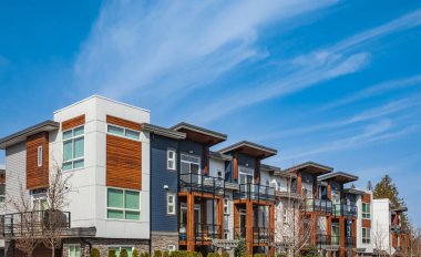 New residential townhouses. Modern apartment buildings in Canada. Modern complex of apartment buildings. Concept of real estate development, house for sale and housing market