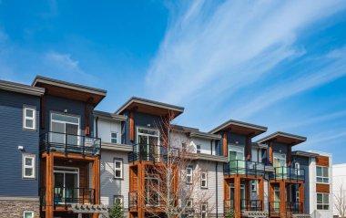 New residential townhouses. Modern apartment buildings in Canada. Modern complex of apartment buildings. Concept of real estate development, house for sale and housing market