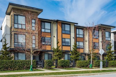 New residential townhouses. Modern apartment buildings in Canada. Modern complex of apartment buildings. Concept of real estate development, house for sale and housing market