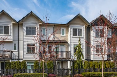 New residential townhouses. Modern apartment buildings in Canada. Modern complex of apartment buildings. Concept of real estate development, house for sale and housing market