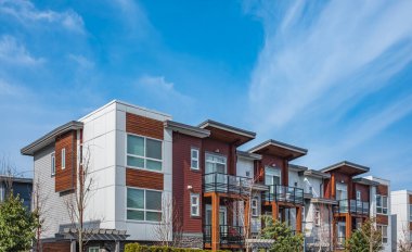 New residential townhouses. Modern apartment buildings in Canada. Modern complex of apartment buildings. Concept of real estate development, house for sale and housing market