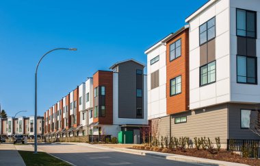 New residential townhouses. Modern apartment buildings in Canada. Modern complex of apartment buildings. Concept of real estate development, house for sale and housing market