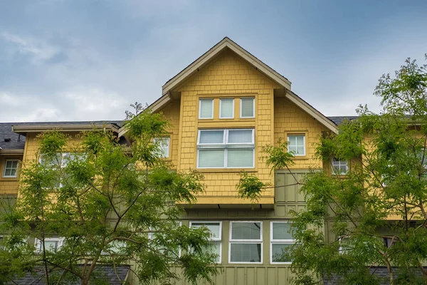 stock image Houses in suburb in the north America. Top of a luxury house with nice windows over blue sky. Beautiful Home Exterior. Real Estate Exterior Front House.nobody, selective focus