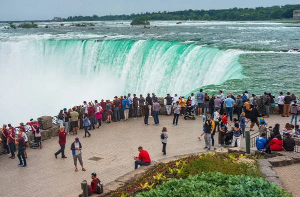 stock image Niagara Tourists observing at the Horseshoe Fall, Niagara Falls, Ontario, Canada. Travelers enjoying the view of Niagra Falls-June 15,2023. Travel photo, copyspace for text