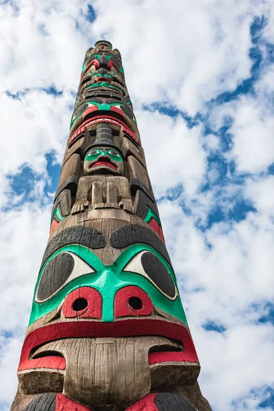 Totem pole by North American Native indians. Totem poles are monumental sculptures carved by indigenous peoples of the Pacific Northwest Coast of North America. Totem pole of the first nations Canada