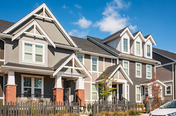 New Modern Apartment Buildings in Vancouver BC. Canadian modern residential architecture on sunny day. Canadian modern residential architecture, low-rise new townhouses. Neighborhood modern houses