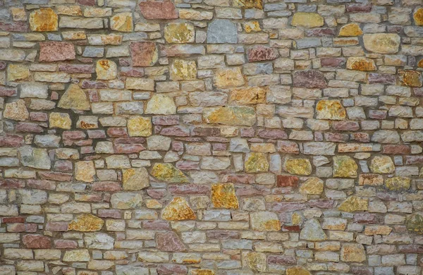 Stone wall. Masonry of stones. New modern stone wall texture background. Real natural color stone wall surface with cement.