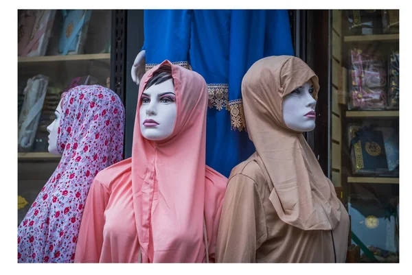 Hijab or scarf at mannequin head at street market. Hijab Mannequin Head, hijab at clothing outlet. Display of Mannequin\'s wearing Muslim head scarfs and Islamic clothing