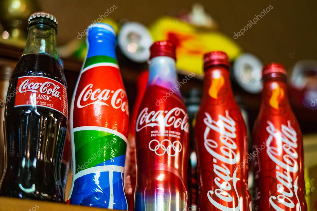 Coca-Cola vintage bottles on the shelf. Coca-Cola Classic. Coca Cola, Coke is the most popular carbonated soft drink beverages sold in stores, throughout the world-March 14,2023-Vancouver Canada