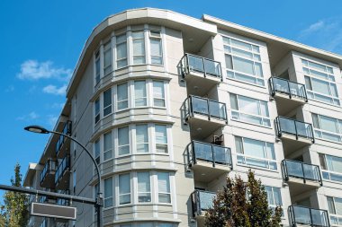 New Modern Apartment Buildings in Vancouver BC. Canadian modern residential architecture on sunny day. Nobody, street photo-Vancouver BC Canada