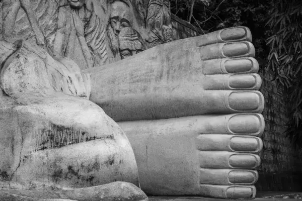 Feet of the reclining Buddha in Long Son Pagoda, Nha Trang city, Vietnam. Long Son Pagoda. sleeping Buddha. Vietnam. Reclining Buddha Statue. Close up view.