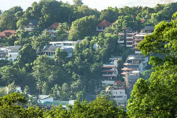 stock image Houses among the green trees on the island hills, Phuket Thailand. New Condos, Houses Property developments. Condominiums in Phuket