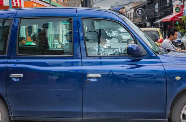 stock image Hackney Carriage, typical London Taxi or Black Cab. Black taxis are symbol of London. manufactured only by the The London Taxi Company. Black taxis are symbol of London. Thailand Phuket