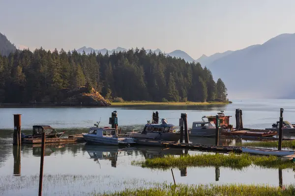 stock image Pitt Meadows surrounded by majestic snow capped mountains, parks, rivers and North America's largest tidal lake. Dock with fishing boats. Nature surrounded with beauty. Travel photo, Copy space.