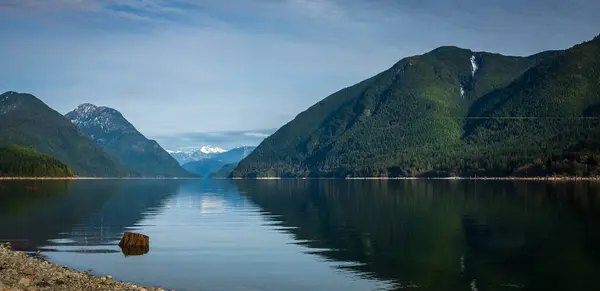 stock image BC parks Canada. British Columbia Provincial parks. Parks for family and friends, Ideal for family picnic. Beautiful Panoramic view of the mountain and pine trees with the reflection in the water.