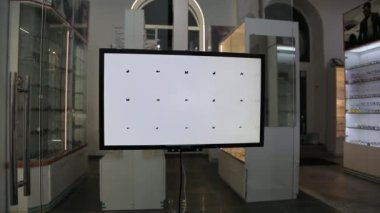 Eyeglasses selection on modern diagnostic equipment in an ophthalmic clinic. Modern diagnostic equipment in ophthalmic clinic.