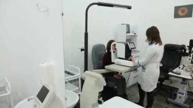 KYIV, UKRAINE - JANUARY 16, 2022: Eyeglasses selection on modern diagnostic equipment in an ophthalmic clinic. Modern diagnostic equipment in ophthalmic clinic - editorial footage