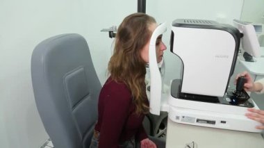 KYIV, UKRAINE - JANUARY 16, 2022: Eyeglasses selection on modern diagnostic equipment in an ophthalmic clinic. Modern diagnostic equipment in ophthalmic clinic - editorial footage