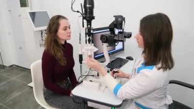 KYIV, UKRAINE - JANUARY 16, 2022: Eyeglasses selection on modern diagnostic equipment in an ophthalmic clinic. Modern diagnostic equipment in ophthalmic clinic - editorial footage