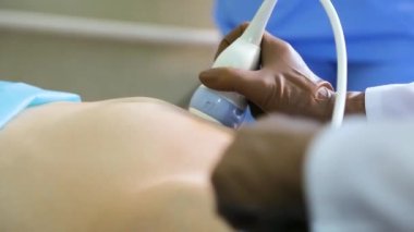 Prenatal ultrasound examination. Ultrasound examination of the fetus of a pregnant woman. Ultrasonic scanner.