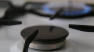 Gas burner. Lighting the gas burner with a match.
