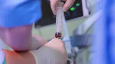 Amniocentesis. Amniotic fluid test. Ultrasound examination of the fetus of a pregnant woman. Ultrasonic scanner.