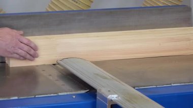 Carpentry production in a small company. Manufacture of wooden window profiles. The company is engaged in the manufacture of wooden windows - editorial footage