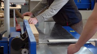 Carpentry production in a small company. Manufacture of wooden window profiles. The company is engaged in the manufacture of wooden windows - editorial footage