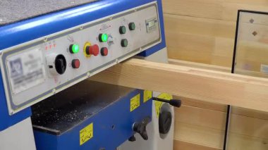 Carpentry production in a small company. Manufacture of wooden window profiles. The company is engaged in the manufacture of wooden windows - editorial footage