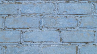 Evin tuğla duvarı. Evin tuğla duvarı maviye boyanmış. Evin mavi duvarı. Maviyle boyanmış tuğla arkaplan