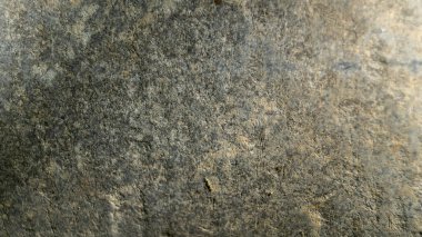 Dokulu yüzey ve güneş ışığı. Kirli taş yüzey. Arkaplan dokusu yüzeyi ve güneş ışığı