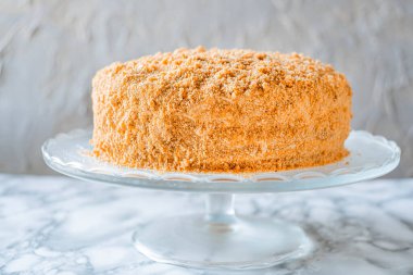 Sweet homemade honey cake on light background.