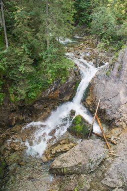 Tatra Mountains. View of the mountain river, waterfall in the mountains.