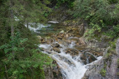 Tatra Mountains. View of the mountain river, waterfall in the mountains.