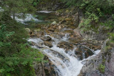 Tatra Mountains. View of the mountain river, waterfall in the mountains.