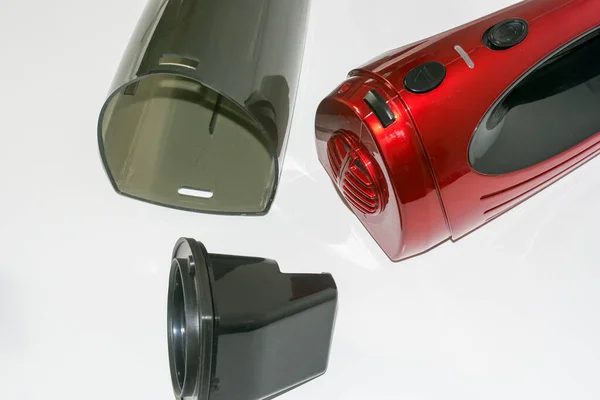 Close-up view of a red car vacuum cleaner