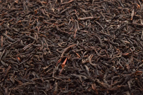 black tea background. dried black tea. English Breakfast Tea ingredients. Ceylon Black Tea close up. top view