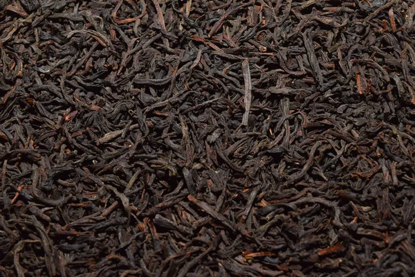 black tea background. dried black tea. English Breakfast Tea ingredients. Ceylon Black Tea close up. top view