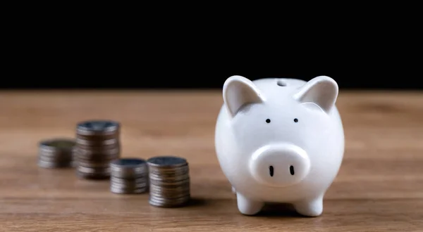 stock image Money coin stack and piggy bank for saving money, wealth and financial concept. Crop close up photo. Investment for rich, retirement. Financial management for future or deposit money for family.